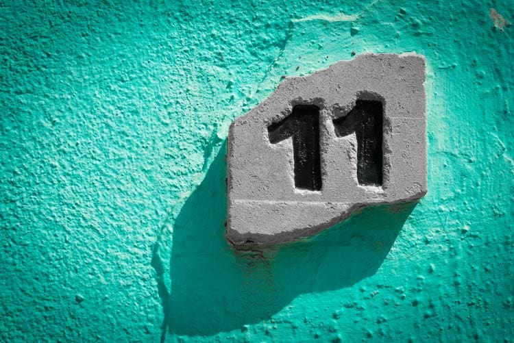 number eleven on bright turquoise stucco building - family therapy