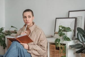 Journaling Prompts, woman journaling thinking