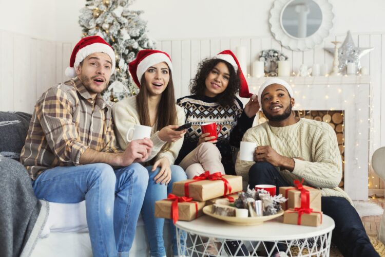 Friends watching movie and having fun at Christmas eve.