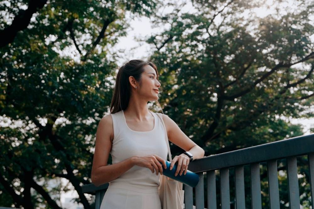 Stress Management 1000 x 667 Woman on a walk in nature reflecting on life with gratitude