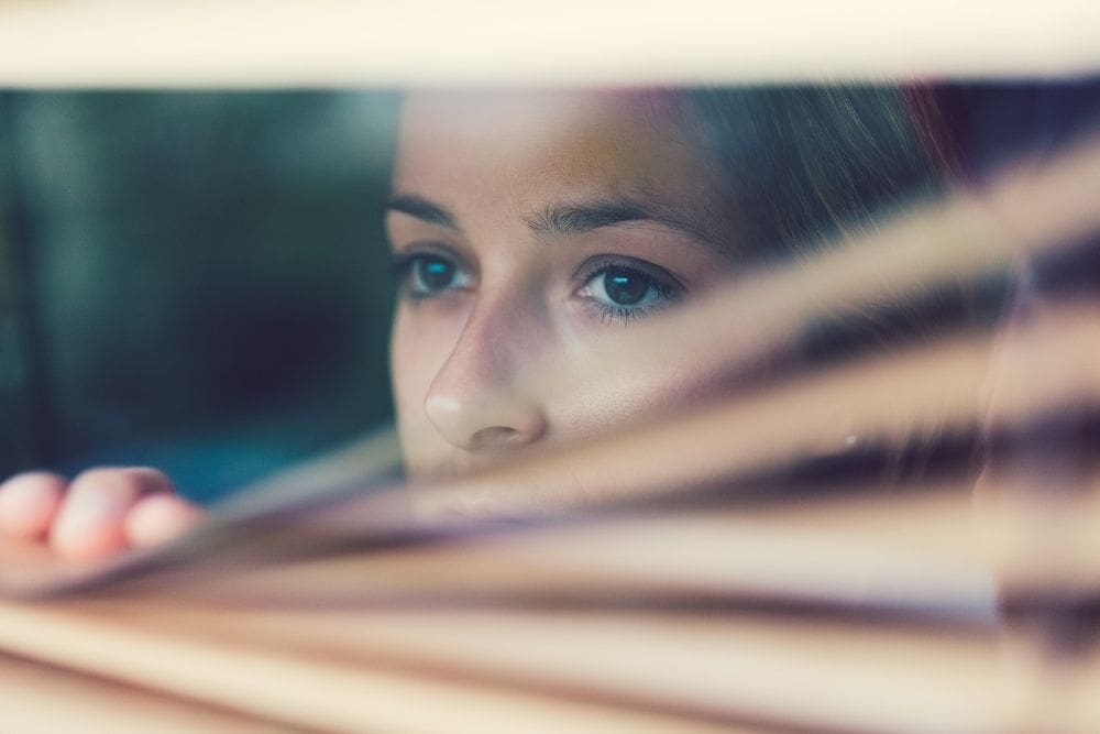 Anabranch – The Devastating Effects of Meth Use – Edited Anabranch - The Devastating Effects of Meth Use. A woman peers out of a window pulling the blinds down.